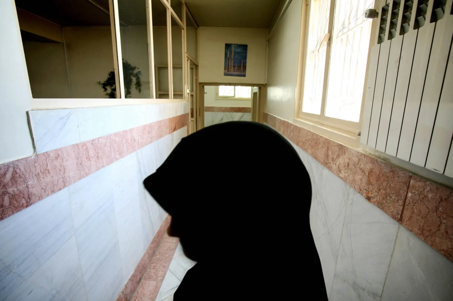 File photo: A female prison guard stands in a corridor in Tehran's Evin Prison in 2006. Morteza Nikoubazl/Reuters