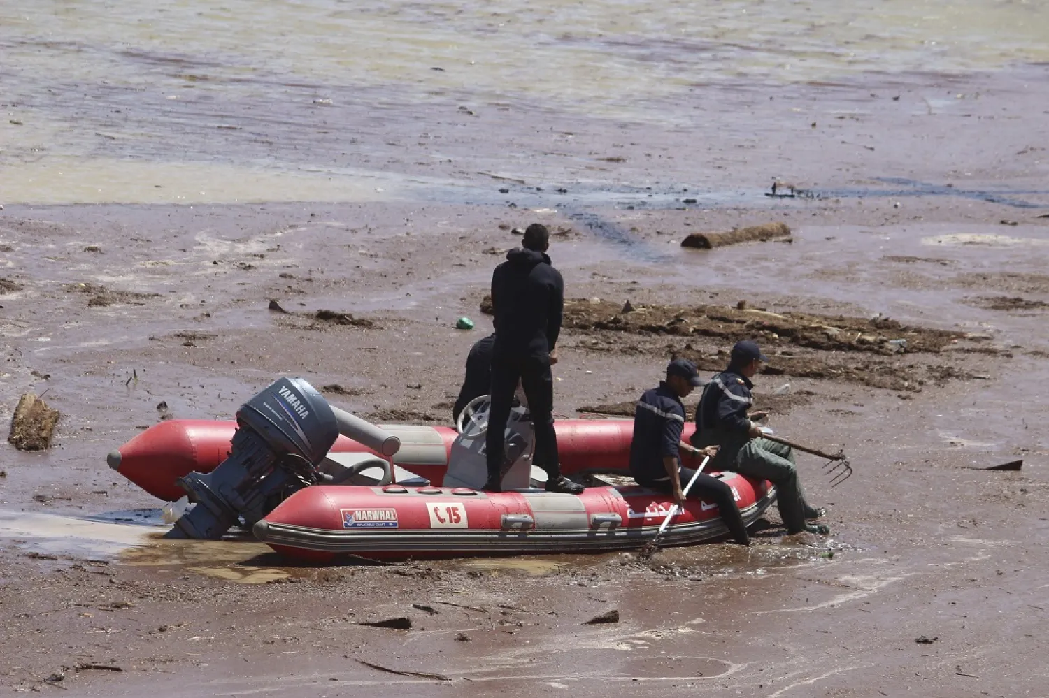 A rescue boat navigates the site of a bus crash in the town of Errachidia, Morocco, Sunday, Sept. 8, 2019. (AP)