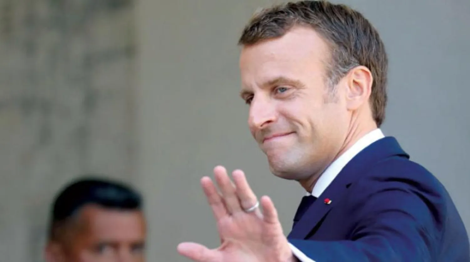 Macron, Trump'ı Tahran'a uygulanan yaptırımları hafifletme konusunda ikna etmeye çalışıyor (AFP)