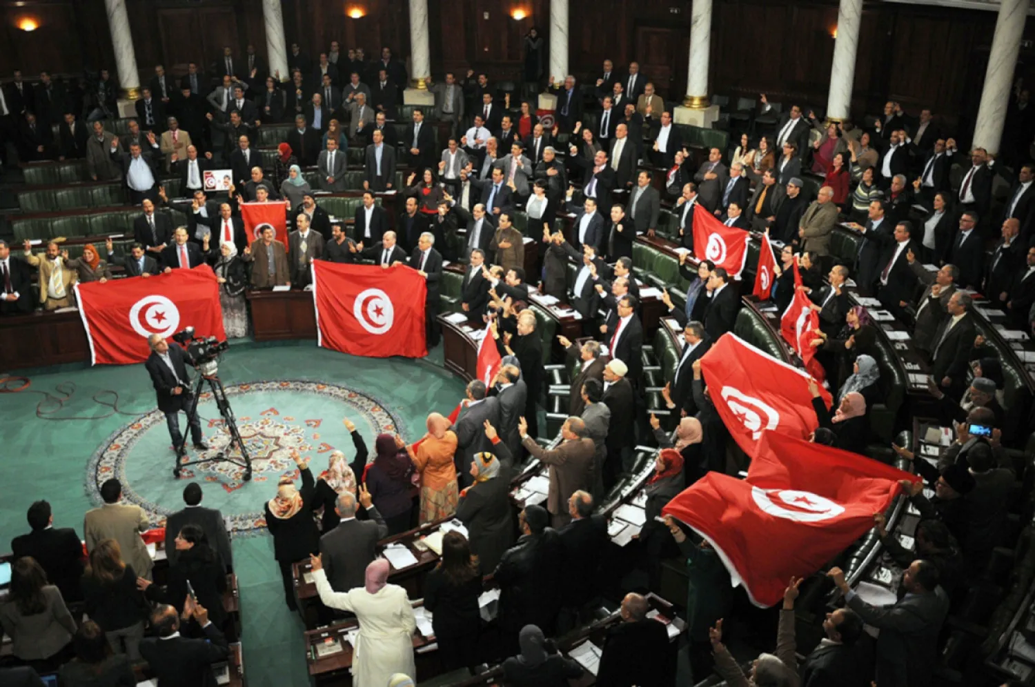 In January 2014, Tunisian lawmakers adopted a new constitution after two years of political turmoil | AFP