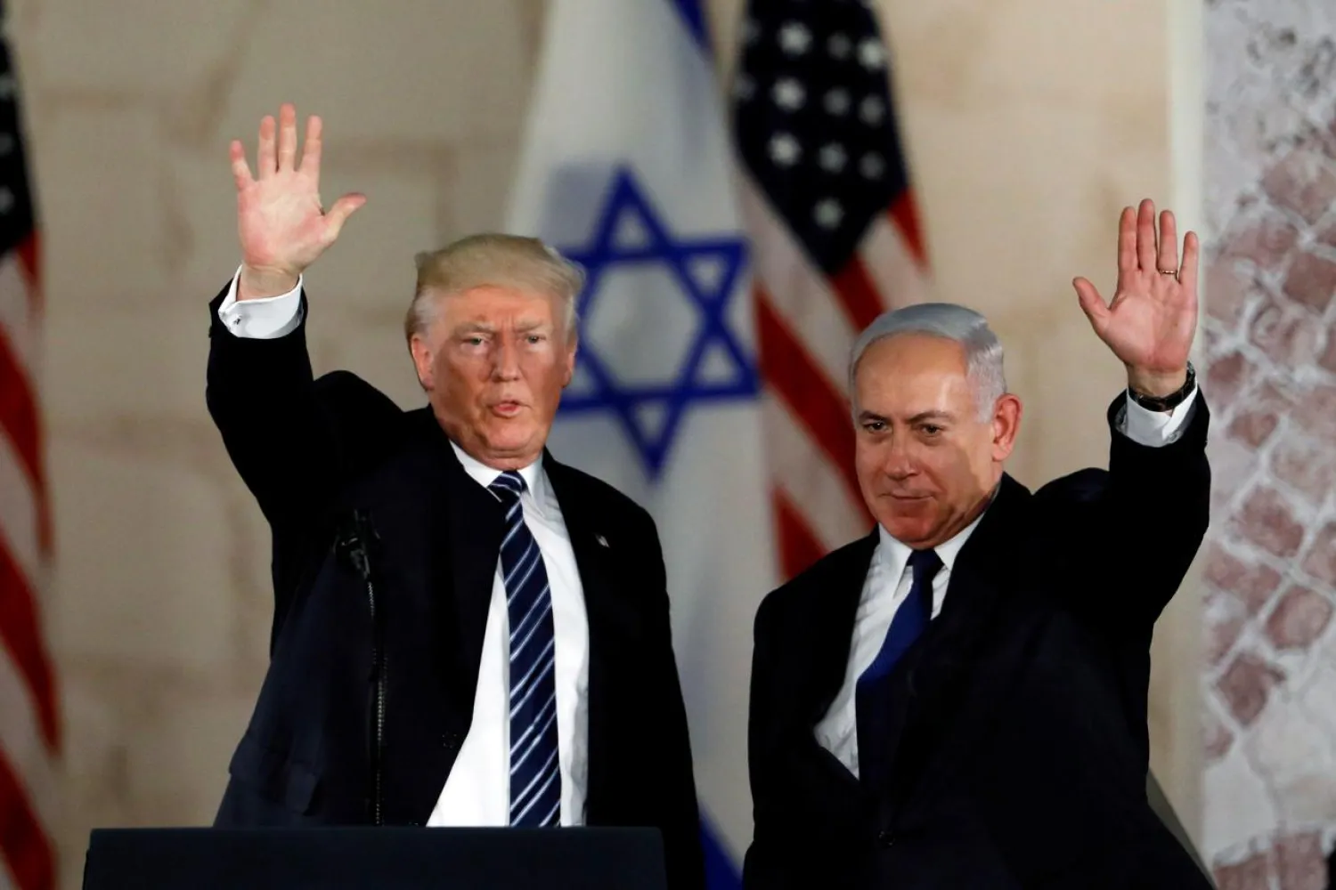 FILE PHOTO: US President Donald Trump and Israeli Prime Minister Benjamin Netanyahu wave after Trump's address at the Israel Museum in Jerusalem May 23, 2017. REUTERS/Ronen Zvulun/File Photo