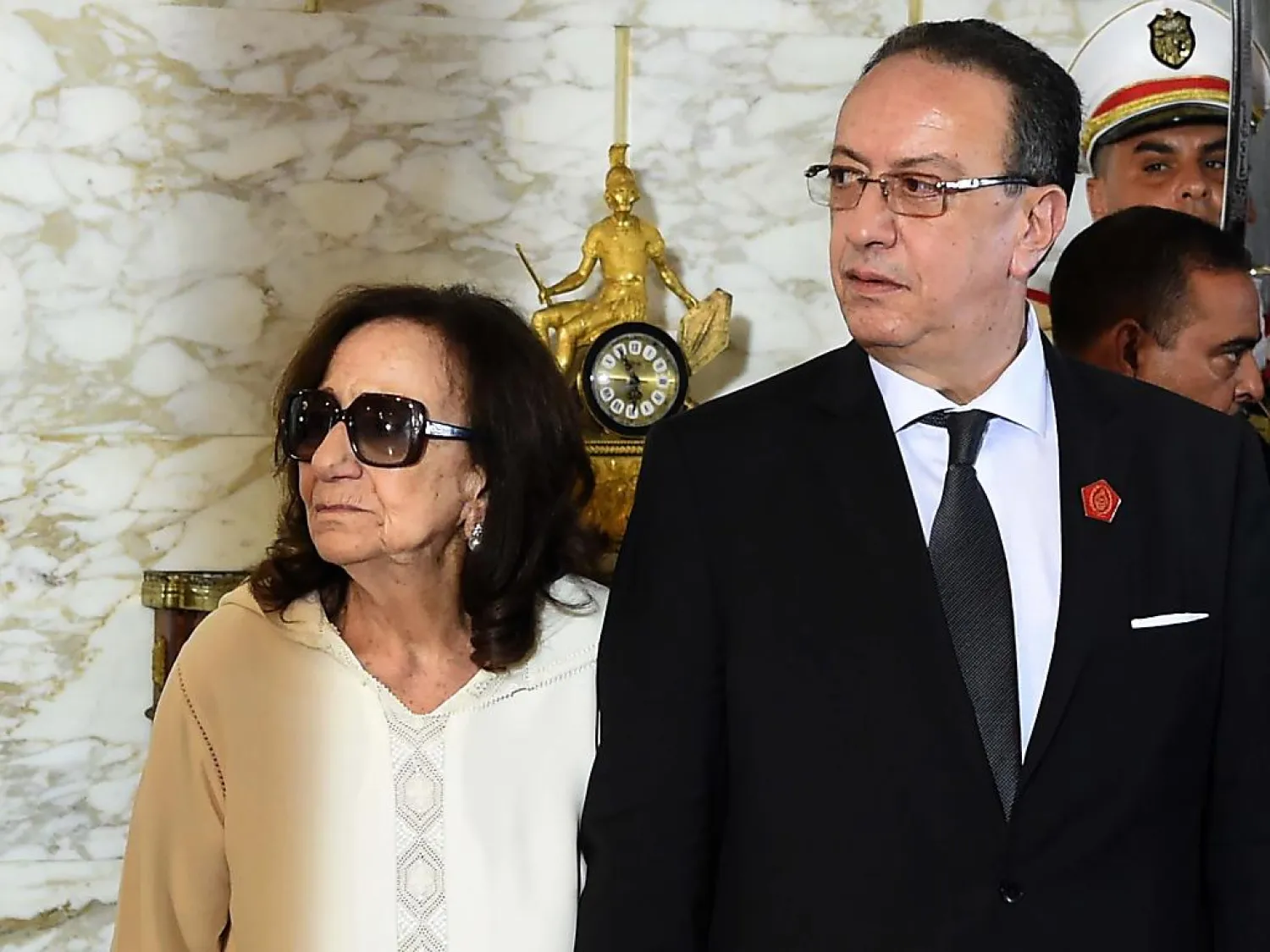 Chadlia Caid Essebsi is seen with her son, Hafedh, at her husband's funeral in July. (AFP)