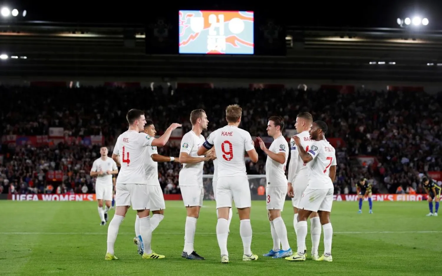 England players celebrate after scoring against Kosovo. (Reuters)