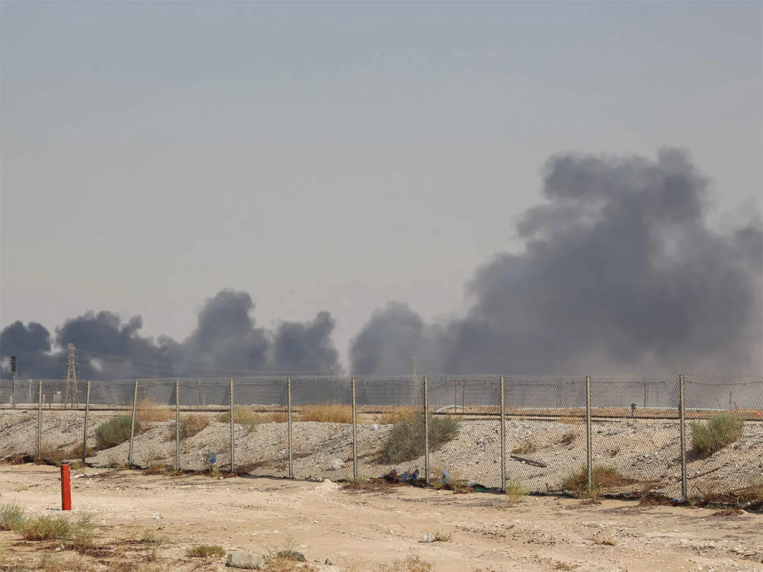 Smoke billows from an Aramco oil facility in Abqaiq in Saudi Arabia's eastern province on September 14, 2019. (AFP)