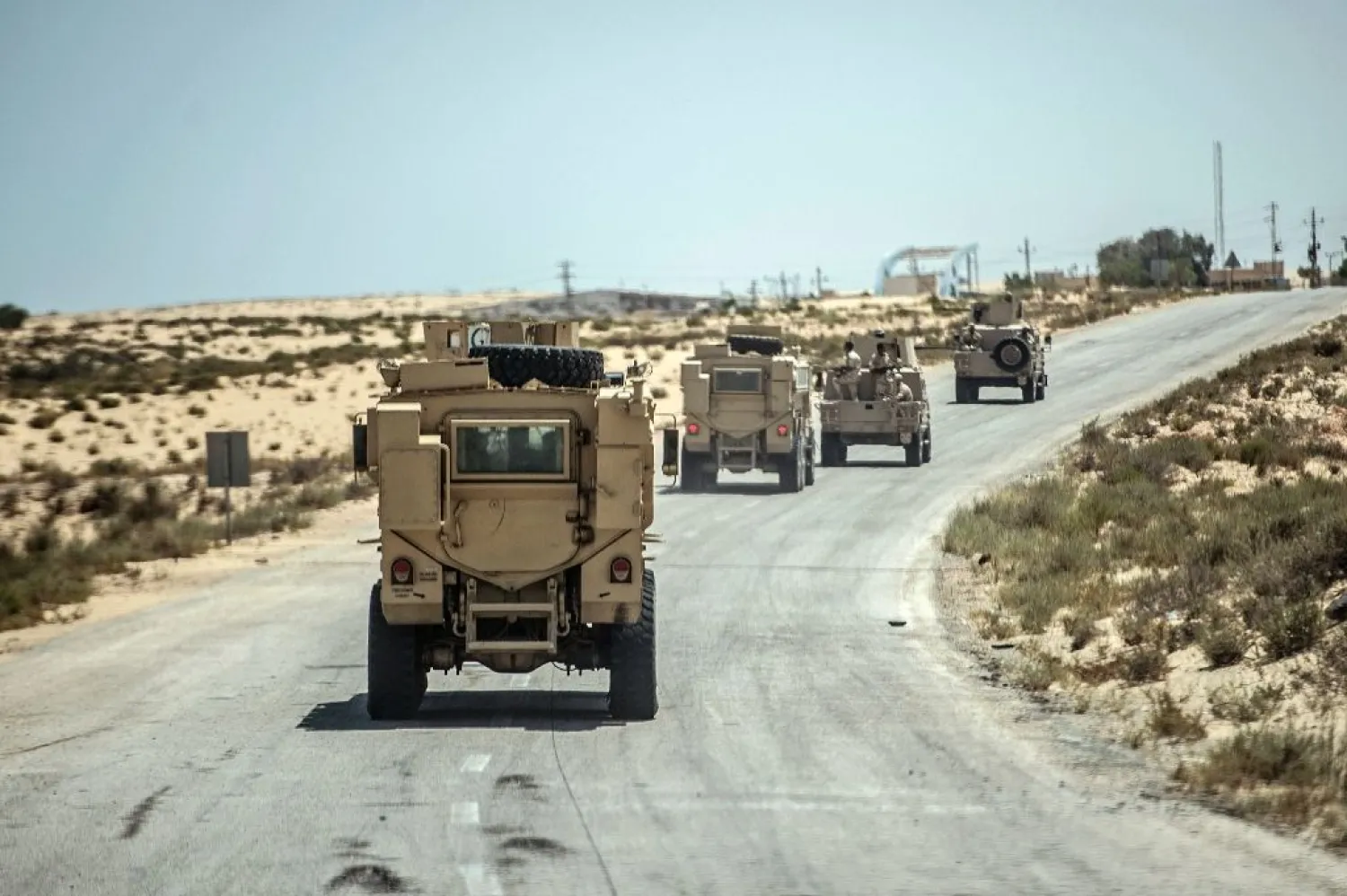 Egyptian security forces drive on a road leading to El-Arish, North Sinai (File Photo: AFP)