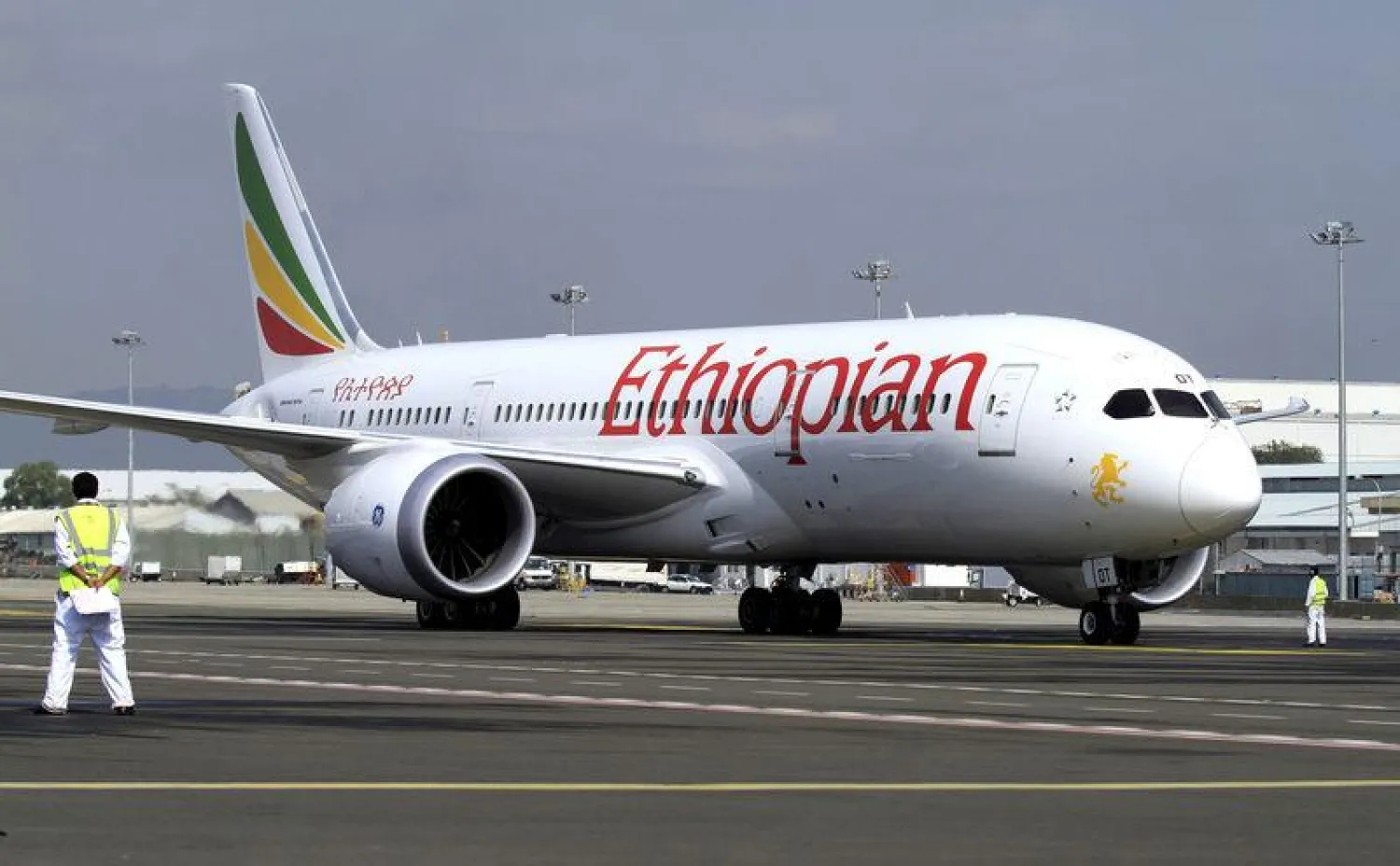 A member of the ground crew directs an Ethiopian Airlines plane at the Bole International Airport in Ethiopia's capital Addis Ababa. (Reuters)