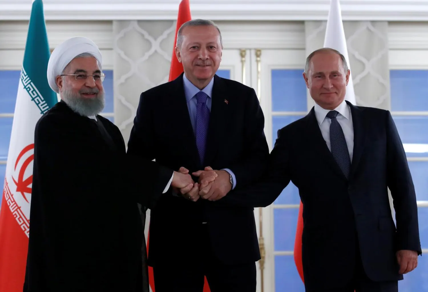 Presidents Hassan Rouhani of Iran, Recep Tayyip Erdogan of Turkey and Vladimir Putin of Russia pose before their meeting in Ankara, Turkey, September 16, 2019. (Reuters)