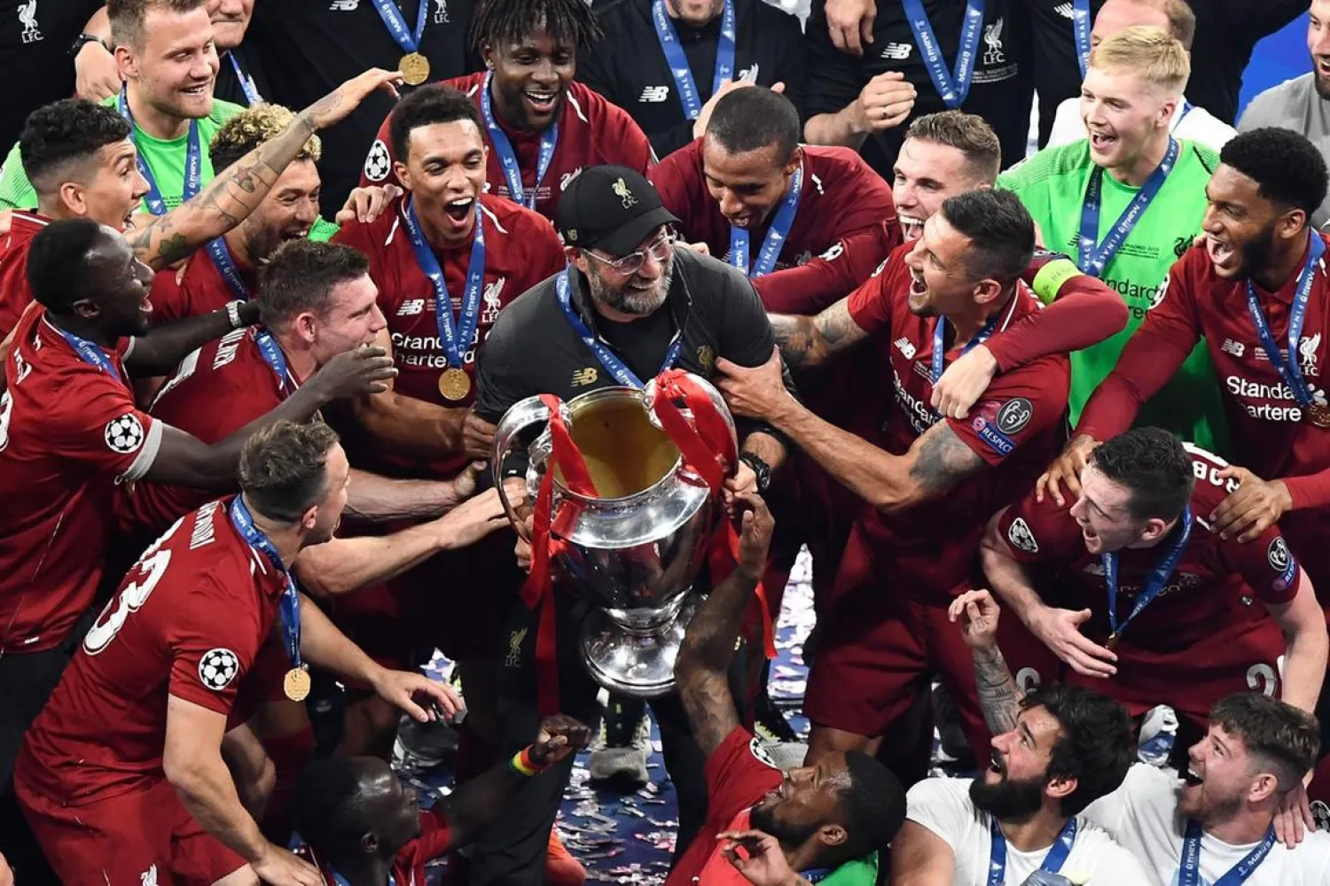 Jurgen Klopp and his Liverpool squad party with the European Cup after winning the Uefa Champions League final. (AFP)