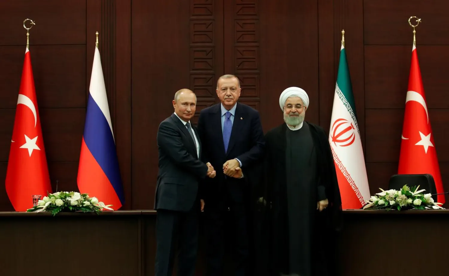 Presidents Vladimir Putin of Russia, Recep Tayyip Erdogan of Turkey and Hassan Rouhani of Iran pose following a joint news conference in Ankara, Turkey, September 16, 2019. REUTERS/Umit Bektas 
