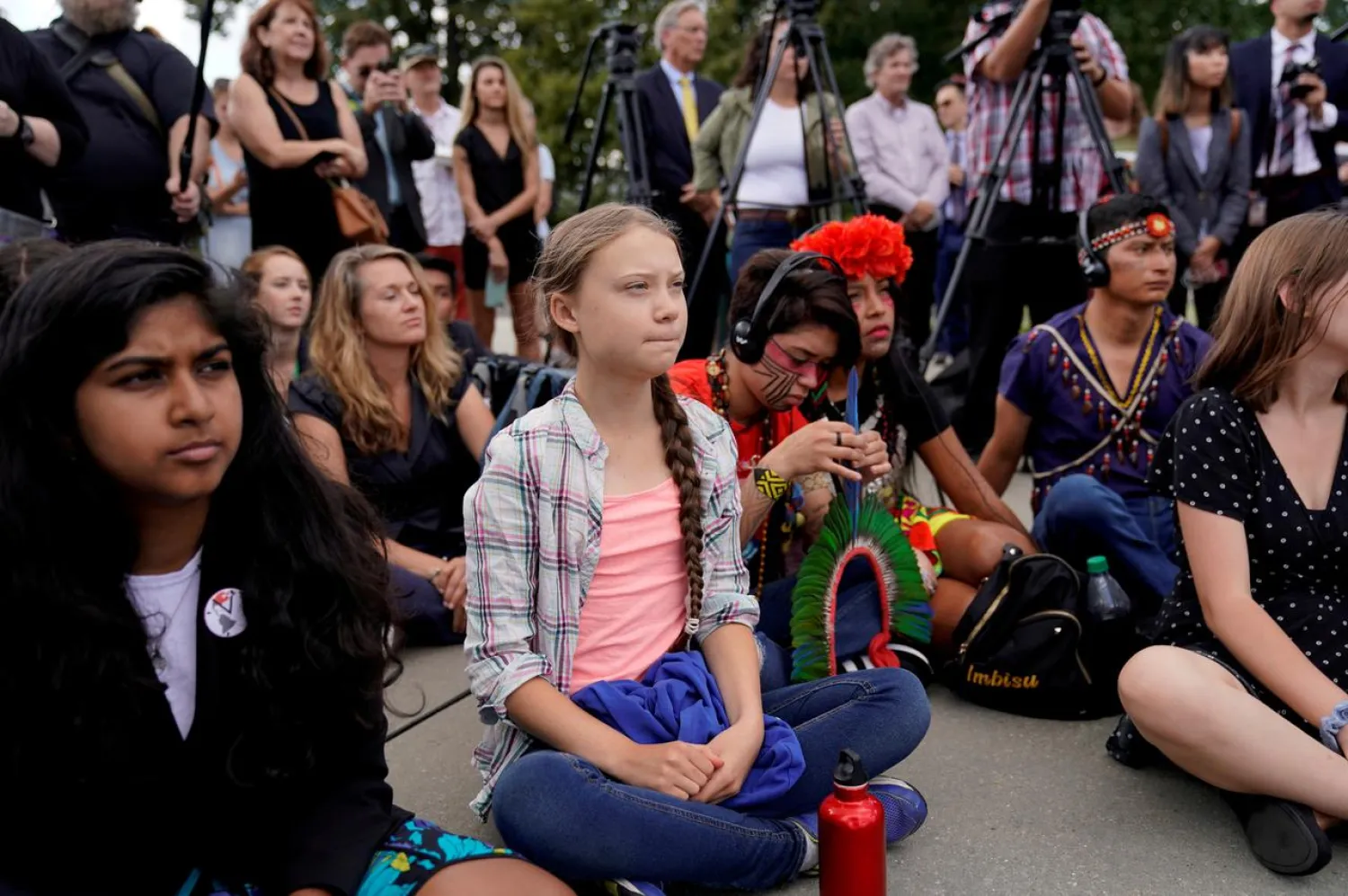 FILE PHOTO: Sixteen year-old Swedish climate activist Greta Thunberg listens to speakers during a climate change demonstration at the U.S. Supreme Court in Washington, U.S., September 18, 2019. REUTERS/Kevin Lamarque
