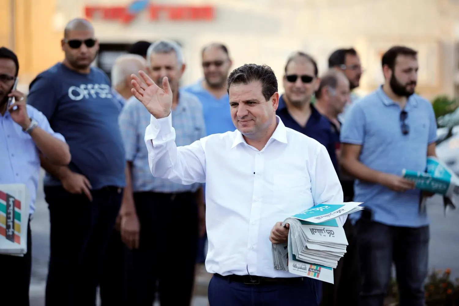 Ayman Odeh, leader of the Joint List, gestures as he hands out pamphlets during an an election campaign event in Tira, northern Israel September 5, 2019. (Reuters)