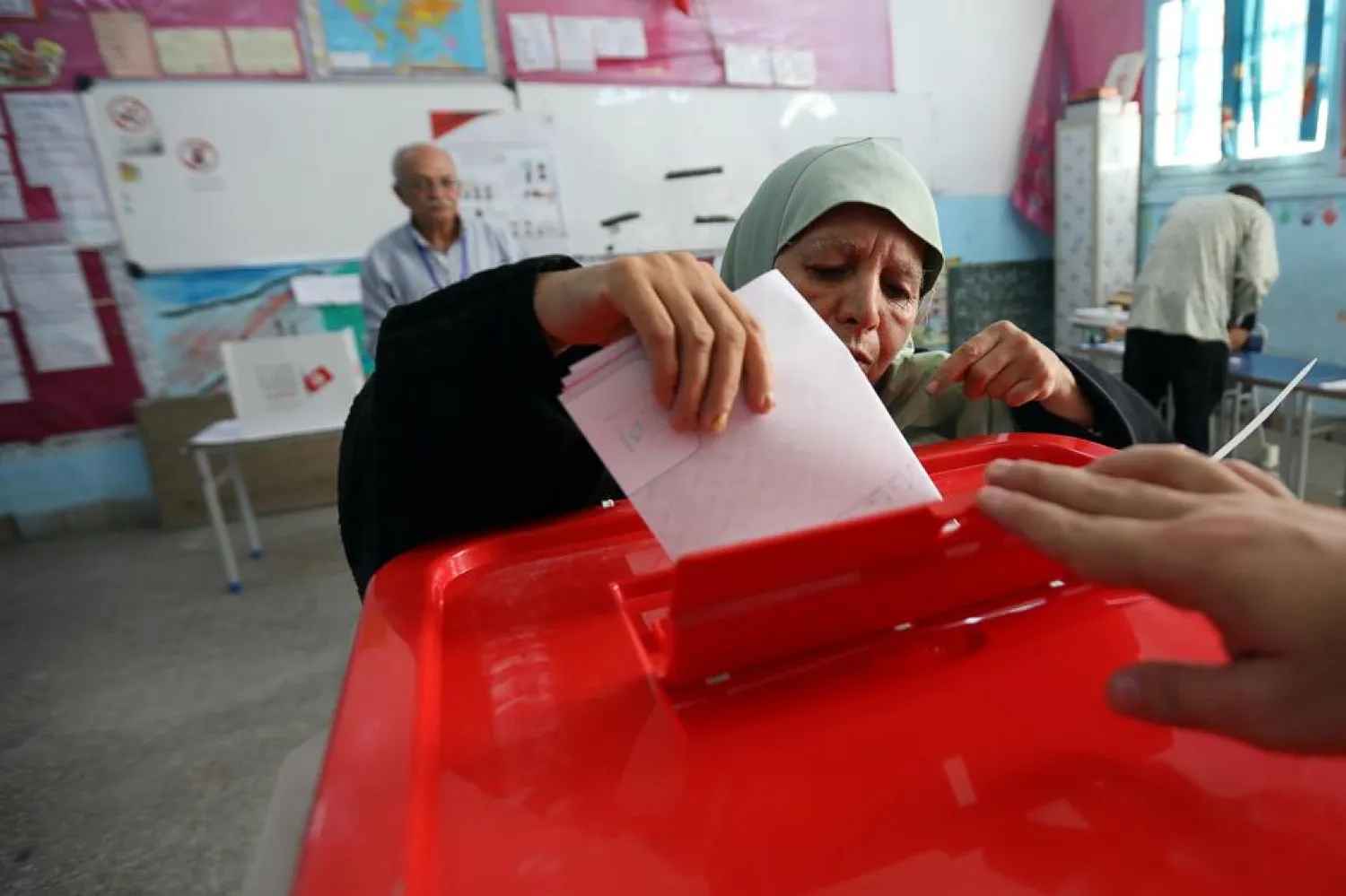 A woman casts her vote in a polling station during presidential election in Tunis, Tunisia, September 15, 2019. REUTERS/Muhammad Hamed