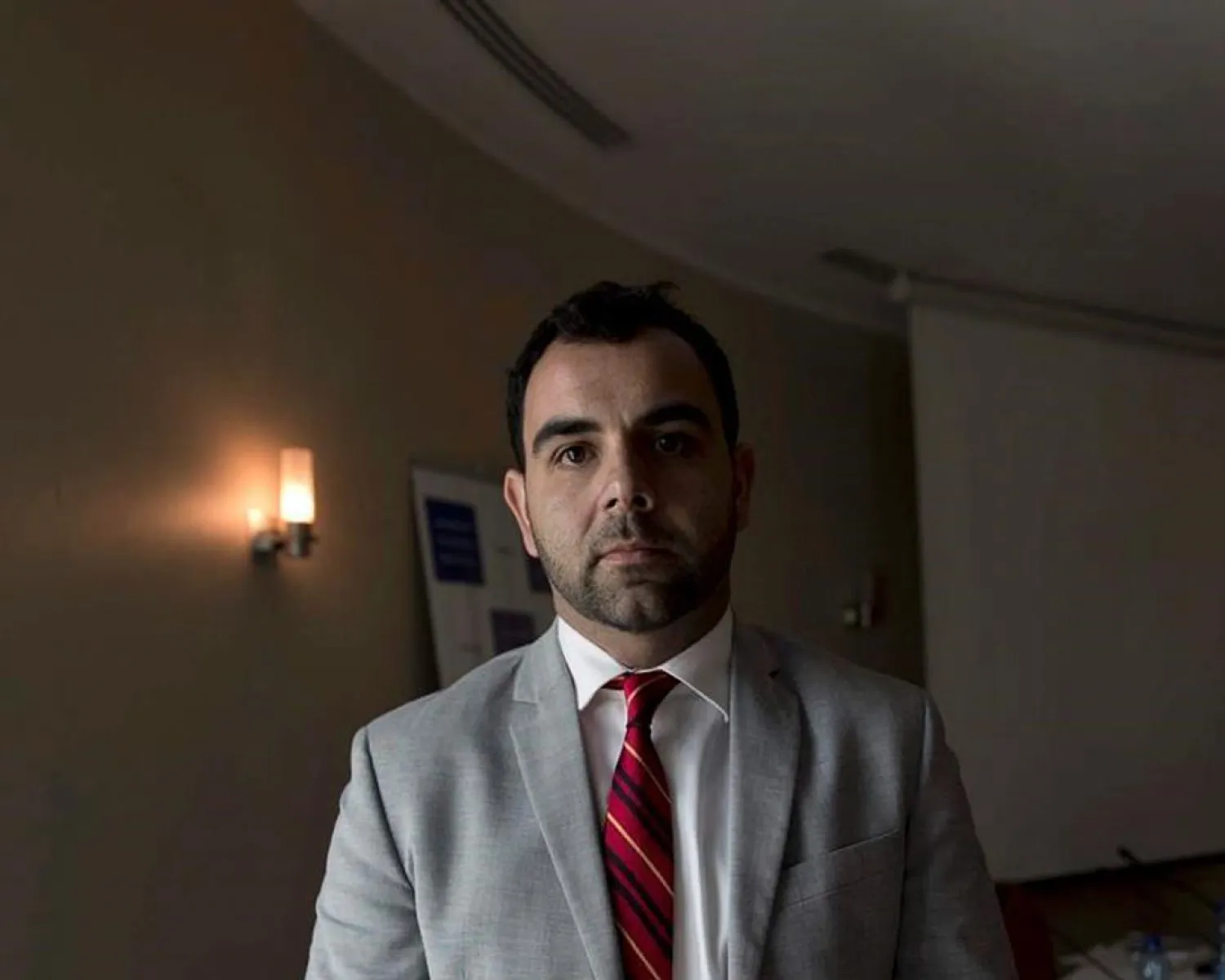 In this Oct. 23, 2018, file photo, Omar Shakir, Israel and Palestine Director of the New York-based Human Rights Watch, poses. (AP Photo/Nasser Nasser, File)