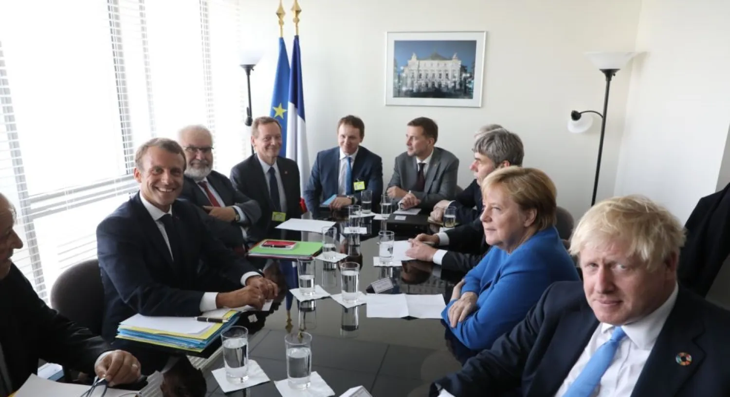 French President Emmanuel Macron (L) meets with German Chancellor Angela Merkel (2-R) and British PM Boris Johnson (R) at the UN headquarters on September 23, 2019. (AFP)