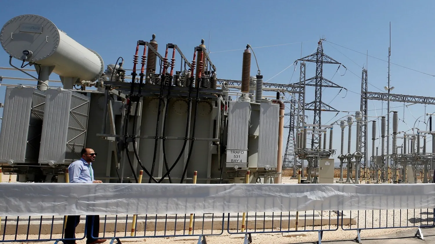 A worker walks in the electrical substation, Jenin, West Bank, July 10, 2017. (Reuters)