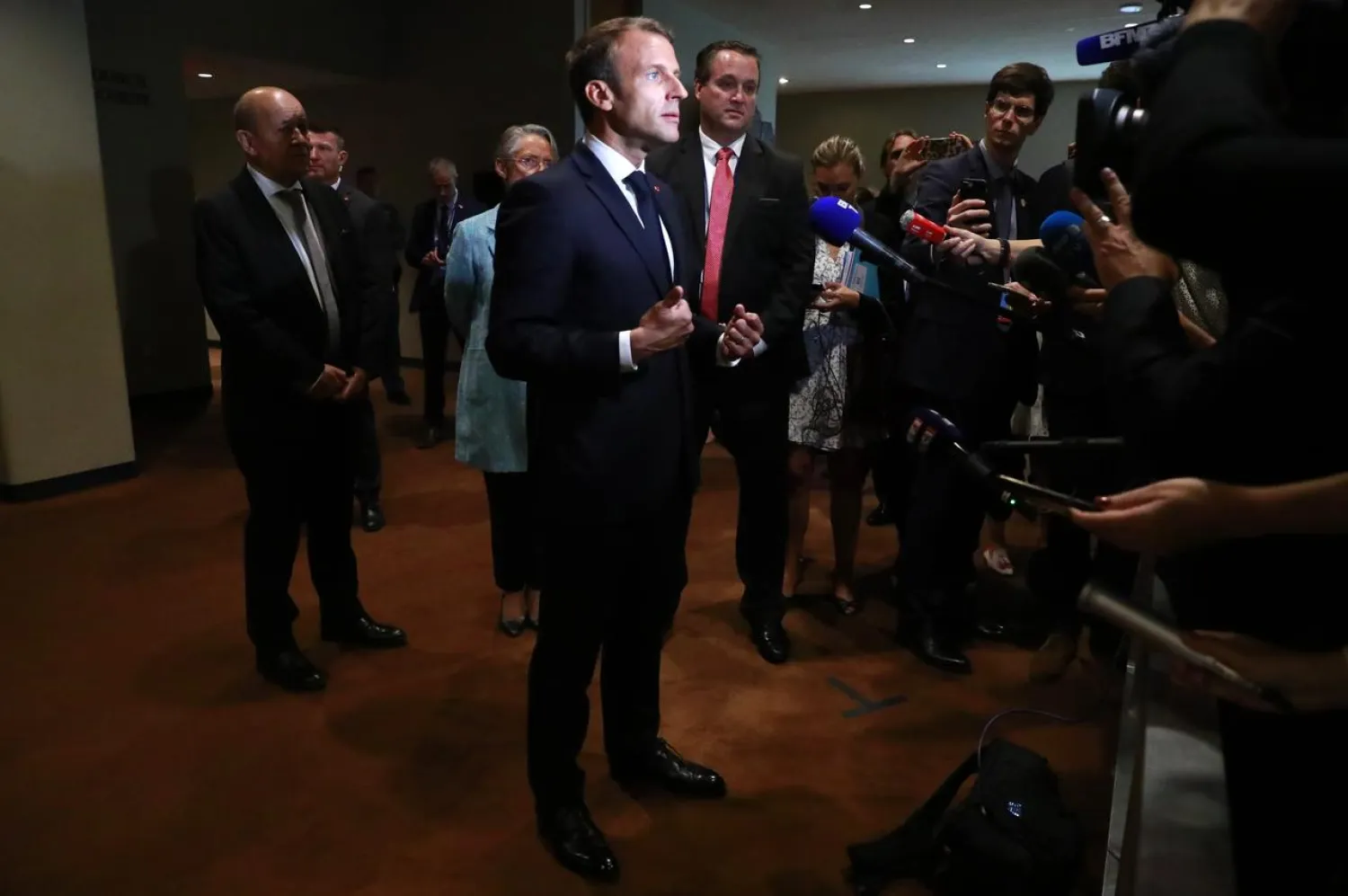 French President Emmanuel Macron speaks to reporters on the sidelines of the 2019 UN Climate Action Summit at UN headquarters in New York City, September 23, 2019. (Reuters)