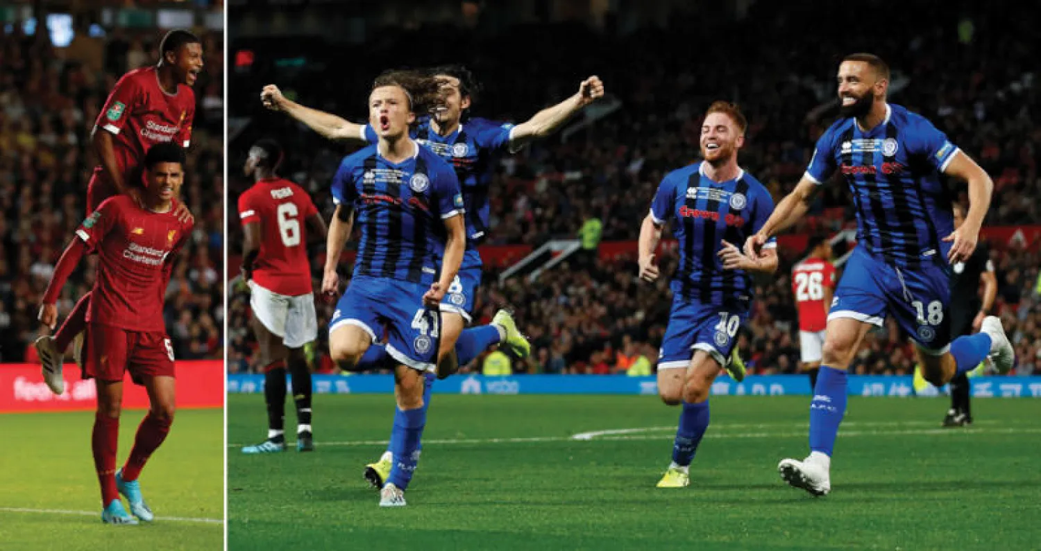 فرحة لاعبي روتشدايل بعد إدراكهم التعادل مع مانشستر يونايتد (رويترز)  -  هوف يحتفل بهدف ليفربول وبروستر على كتفيه (رويترز)