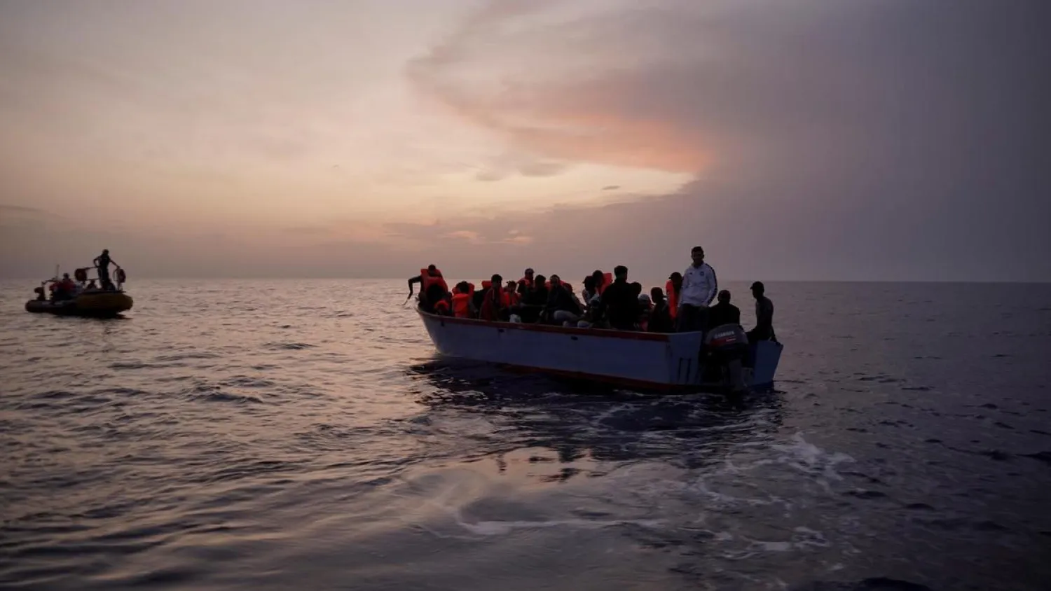 Migrants on an overcrowded wooden boat wait to be rescued in the Mediterranean Sea. (AP file photo)