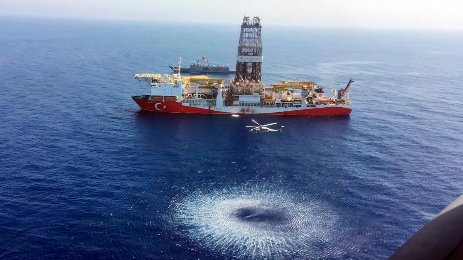 A helicopter flies over Turkish drilling ship Fatih as it sails towards Cyprus in the eastern Mediterranean. (AP file photo)