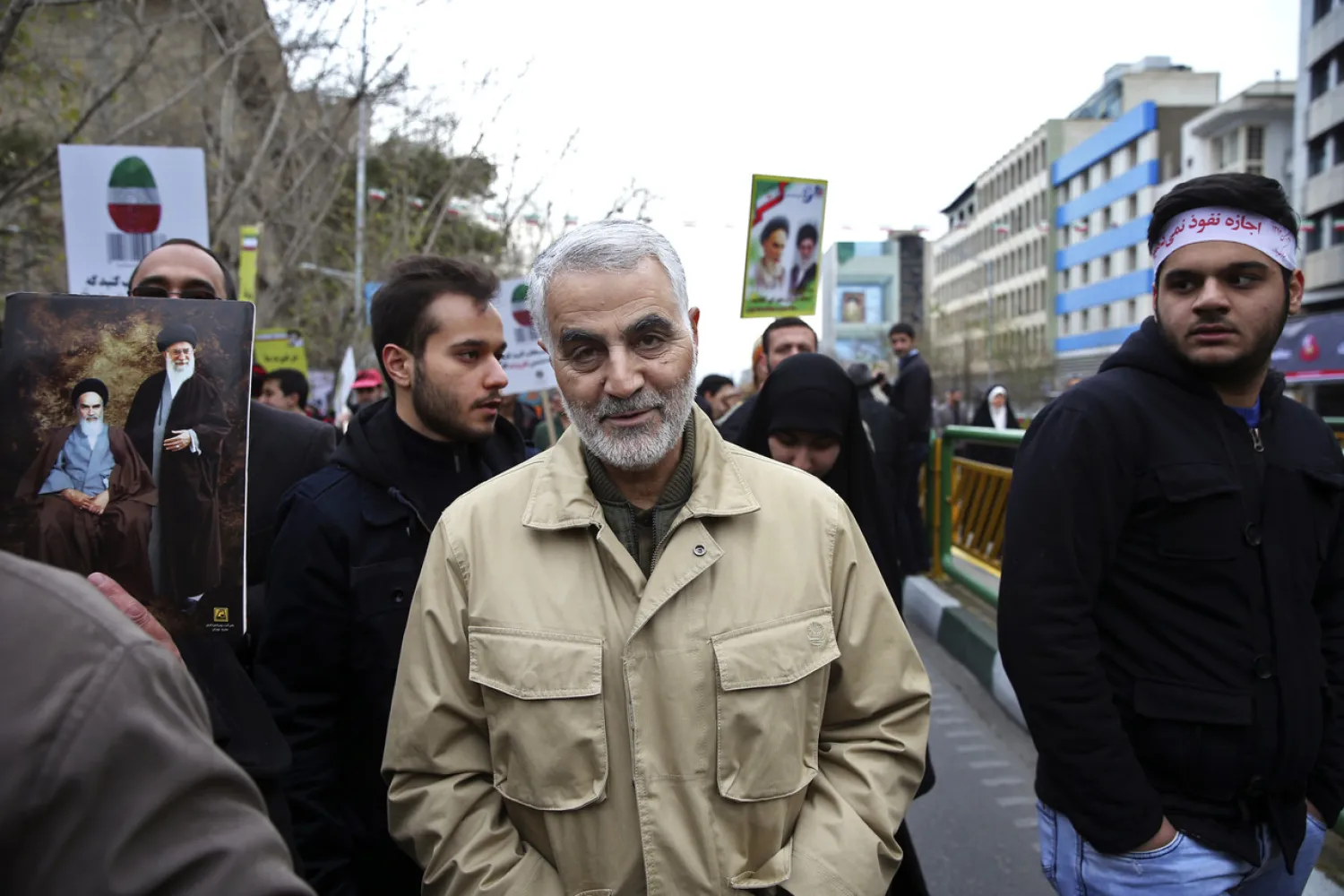 In this Feb. 11, 2016 file photo, Revolutionary Guard Gen. Qassem Soleimani, center, attends an annual rally commemorating the anniversary of the 1979 Islamic revolution, in Tehran, Iran. (AP Photo/Ebrahim Noroozi, File)