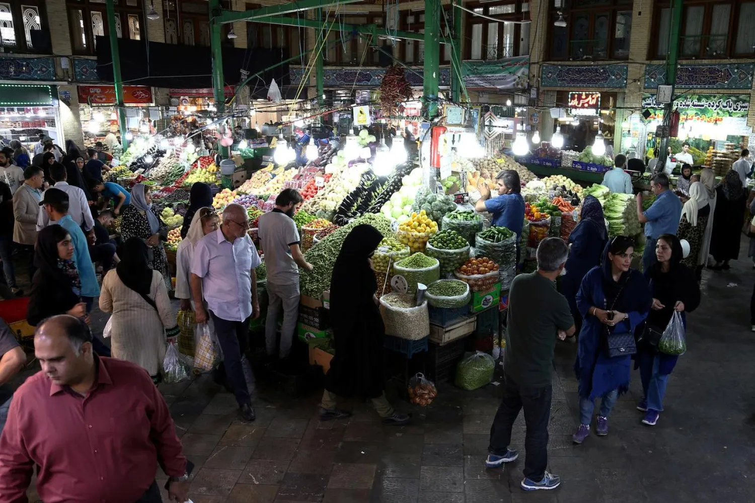  People buy fruits and vegetables from Tajrish Bazaar in Tehran, Iran August 1, 2019. Nazanin Tabatabaee/WANA (West Asia News Agency) via REUTERS/File Photo