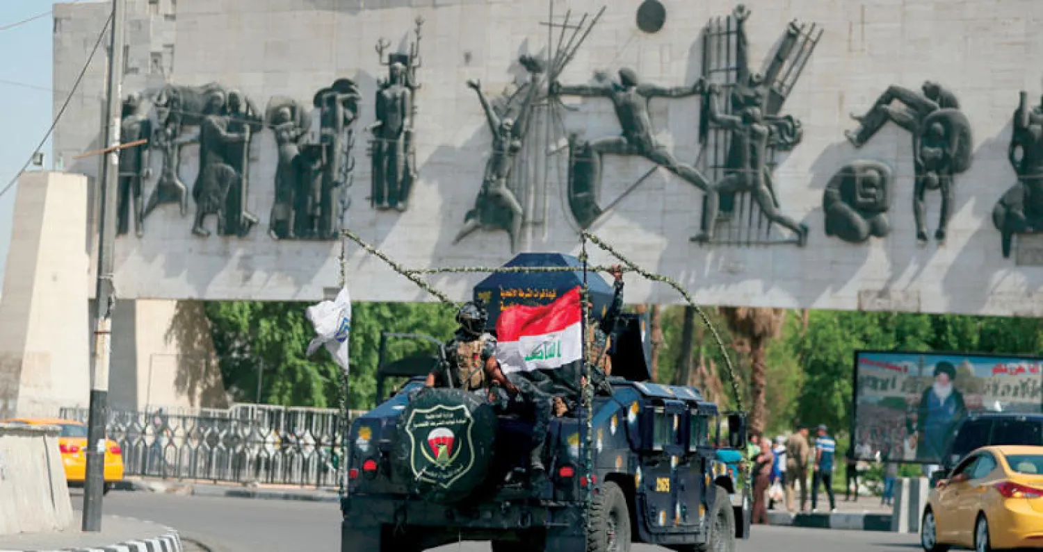 انتشار أمني في محيط ساحة التحرير في بغداد أمس (أ.ب)