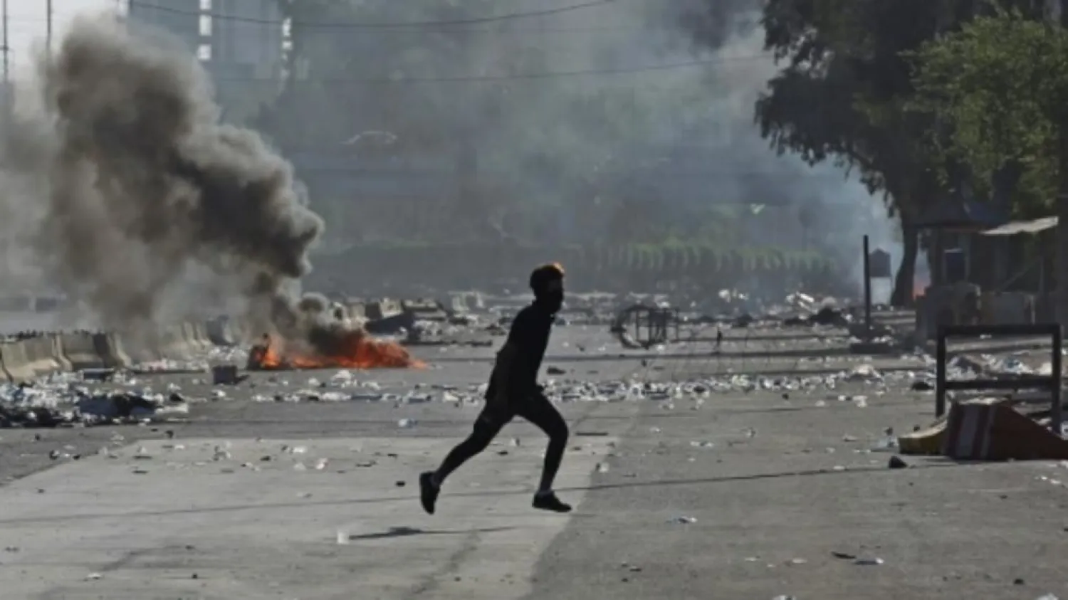 Four days of running clashes between protesters and riot police have left parts of the Iraq capital looking like a war zone | AFP