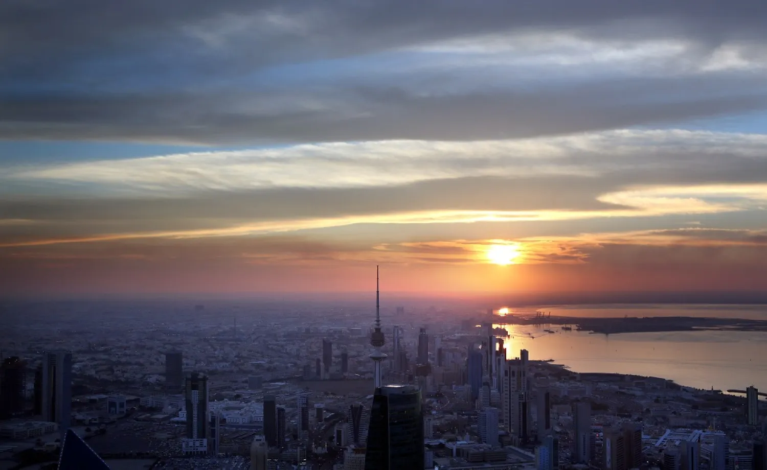 A picture taken on December 19, 2014 from the top of al-Hamra Tower shows a view of Kuwait City at sunset. (AFP)