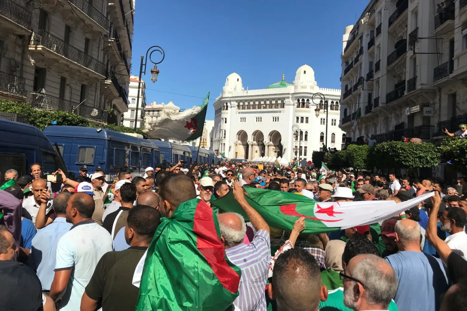 Demonstrators carry national flags during a protest demanding the army quit politics, a purge of the ruling elite, an end to corruption, and the freeing of opposition leaders in Algiers, Algeria October 4, 2019. REUTERS/Abdelaziz Boumzar