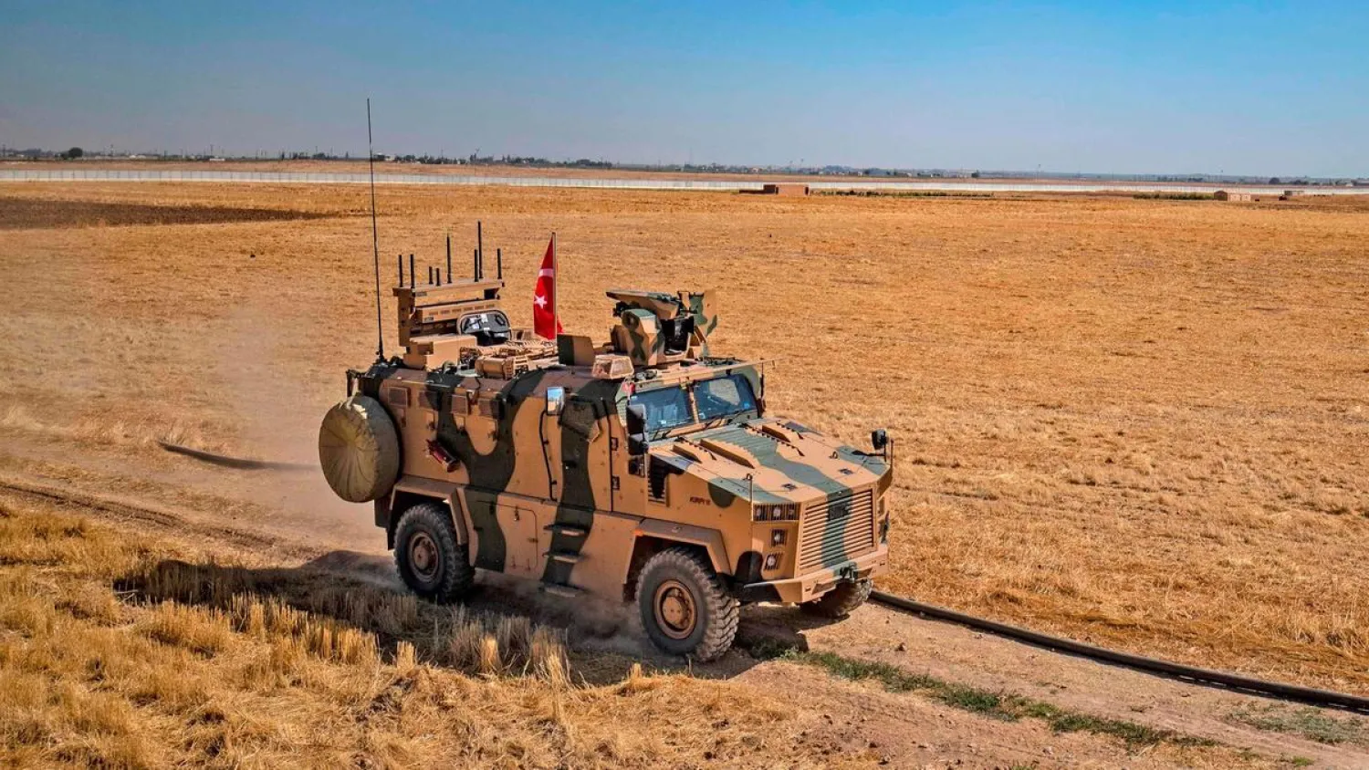 A Turkish military vehicle takes part in joint patrol with the US military convoy on the outskirts of the Syrian border town Tal Abyad on September 24, 2019. (AFP)