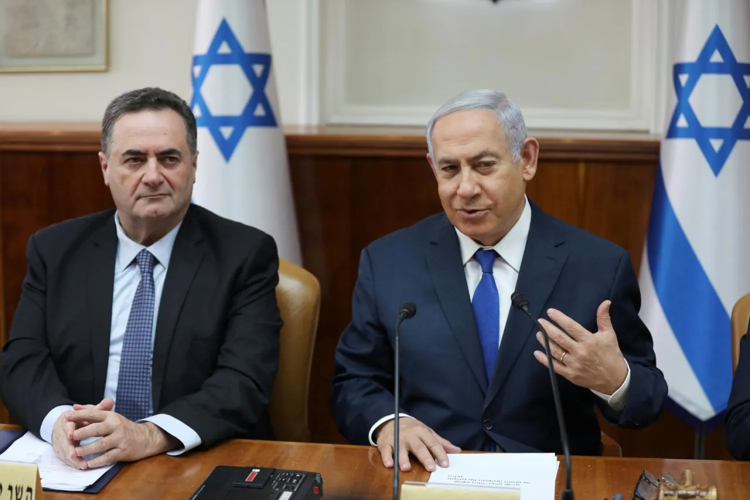 Israeli Prime Minister Benjamin Netanyahu sits next to acting foreign minister Israel Katz, who also serves as intelligence and transport minister, during the weekly cabinet meeting in Jerusalem February 24, 2019. Abir Sultan/Pool via REUTERS