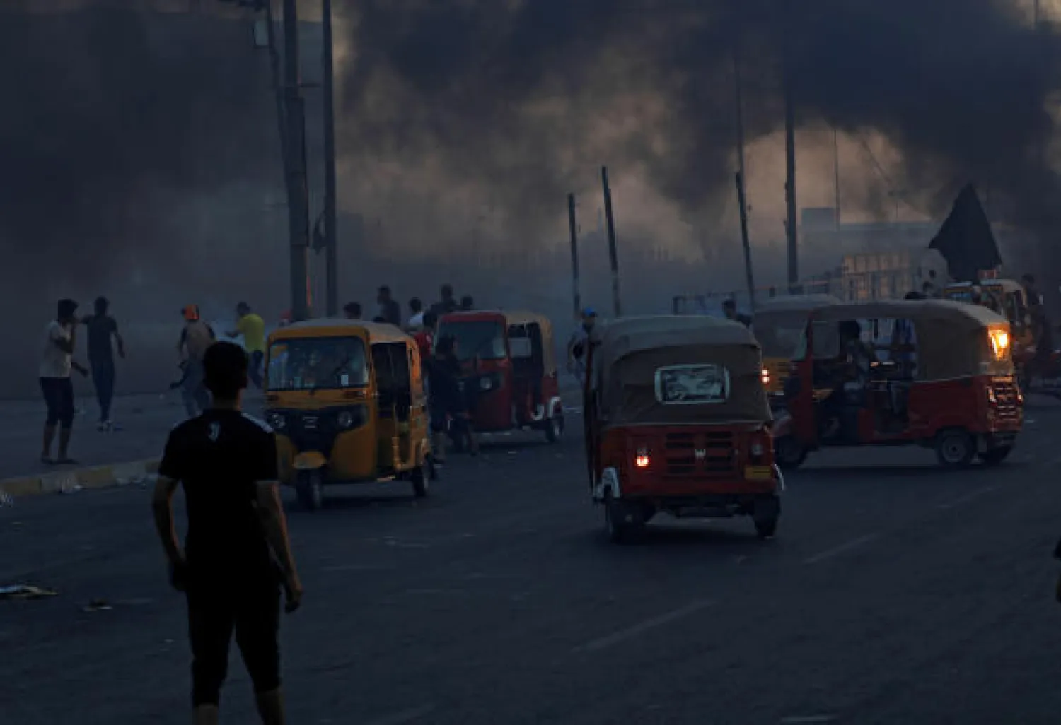 Young tuk-tuk drivers wait to carry wounded protesters to transfer them to hospitals during anti-government protests in Baghdad, Iraq October 5, 2019. Picture taken October 5, 2019. REUTERS/Thaier Al-Sudani