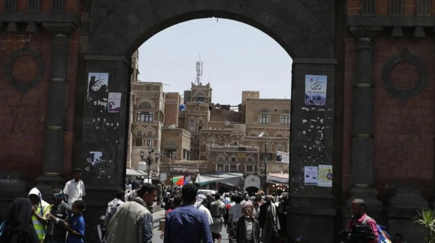 People walk through the main gate of the Old City of Sanaa. (Reuters)