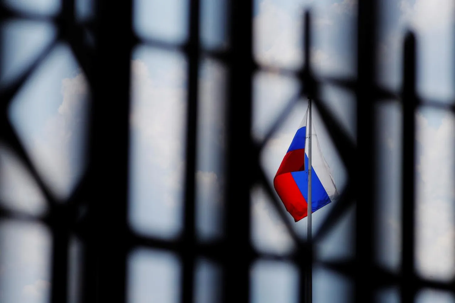 The Russian flag flies over the Embassy of Russia in Washington, US, August 6, 2018. REUTERS/Brian Snyder