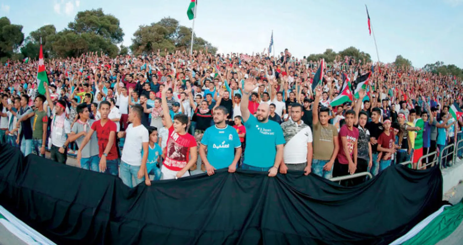 جماهير أردنية حضرت لمساندة منتخبها في مباراة الكويت (أ.ف.ب)