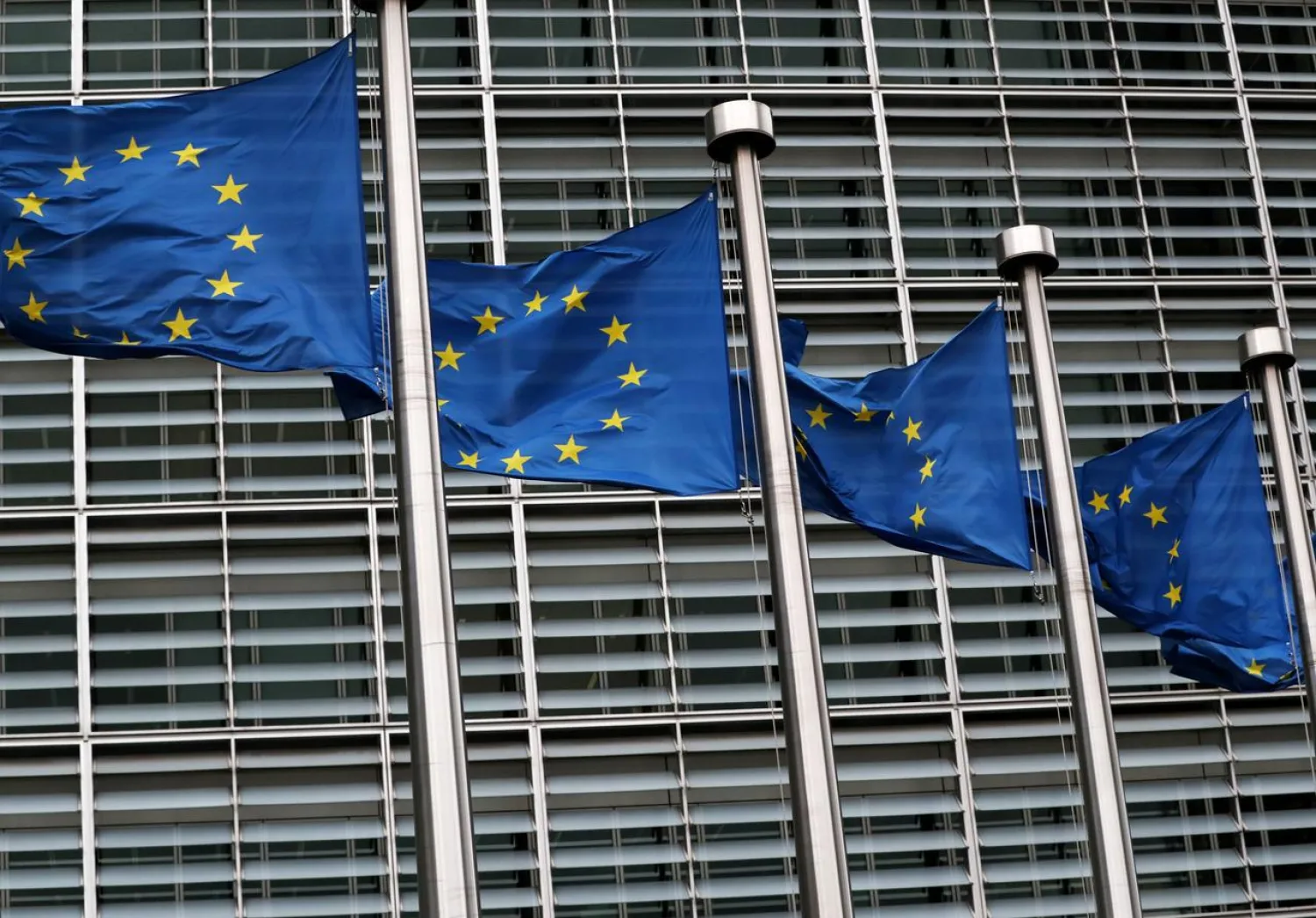 FILE PHOTO: European Union flags fly outside the European Commission headquarters in Brussels, Belgium, March 6, 2019. REUTERS/Yves Herman