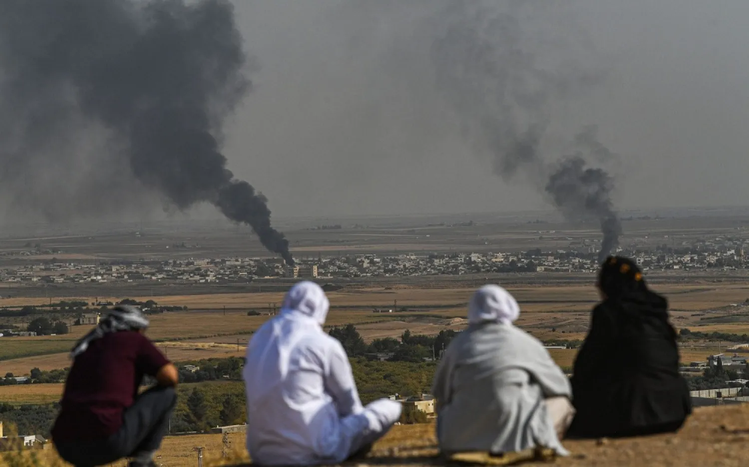 Turkish residents watch the fierce battle for Ras al-Ain from across the border. (AFP)