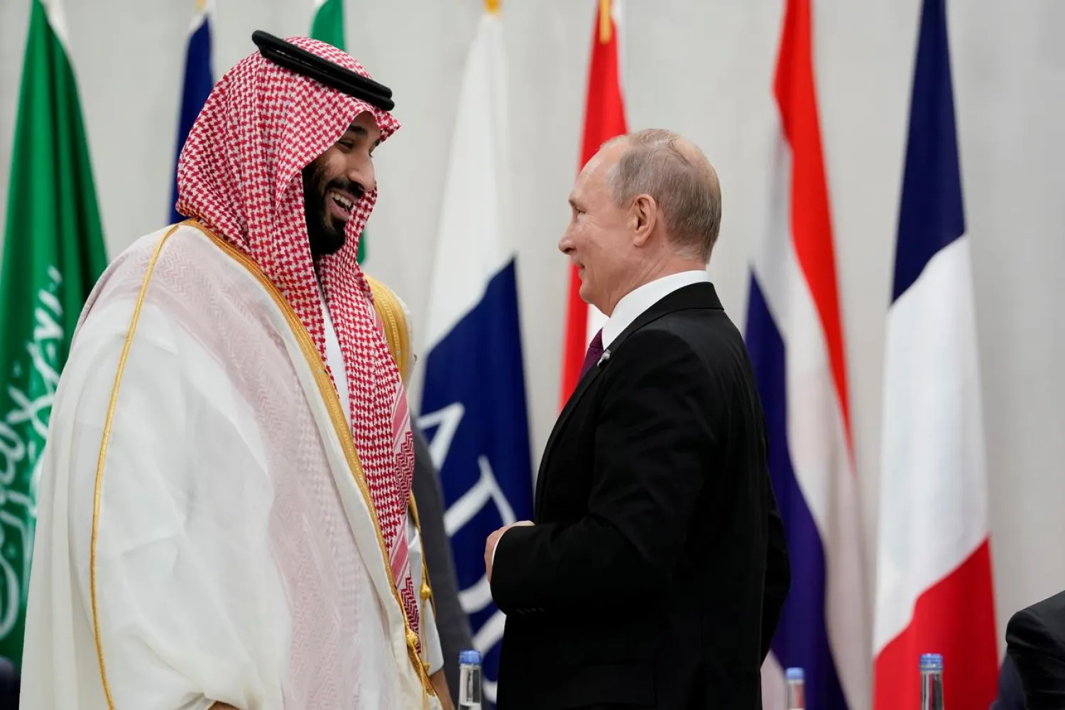 Saudi Arabia's Crown Prince Mohammed bin Salman and Russia's President Vladimir Putin speak during a meeting at the G20 leaders summit in Osaka, Japan, June 28, 2019. REUTERS/Kevin Lamarque/File Photo
