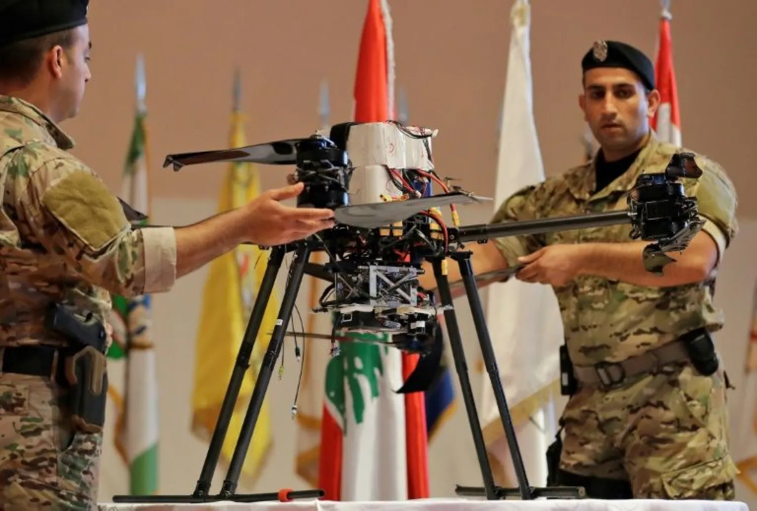 Lebanese soldiers carry an Israeli drone that was captured after falling in a southern Beirut suburb, during a press conference at the defense ministry in September. AFP