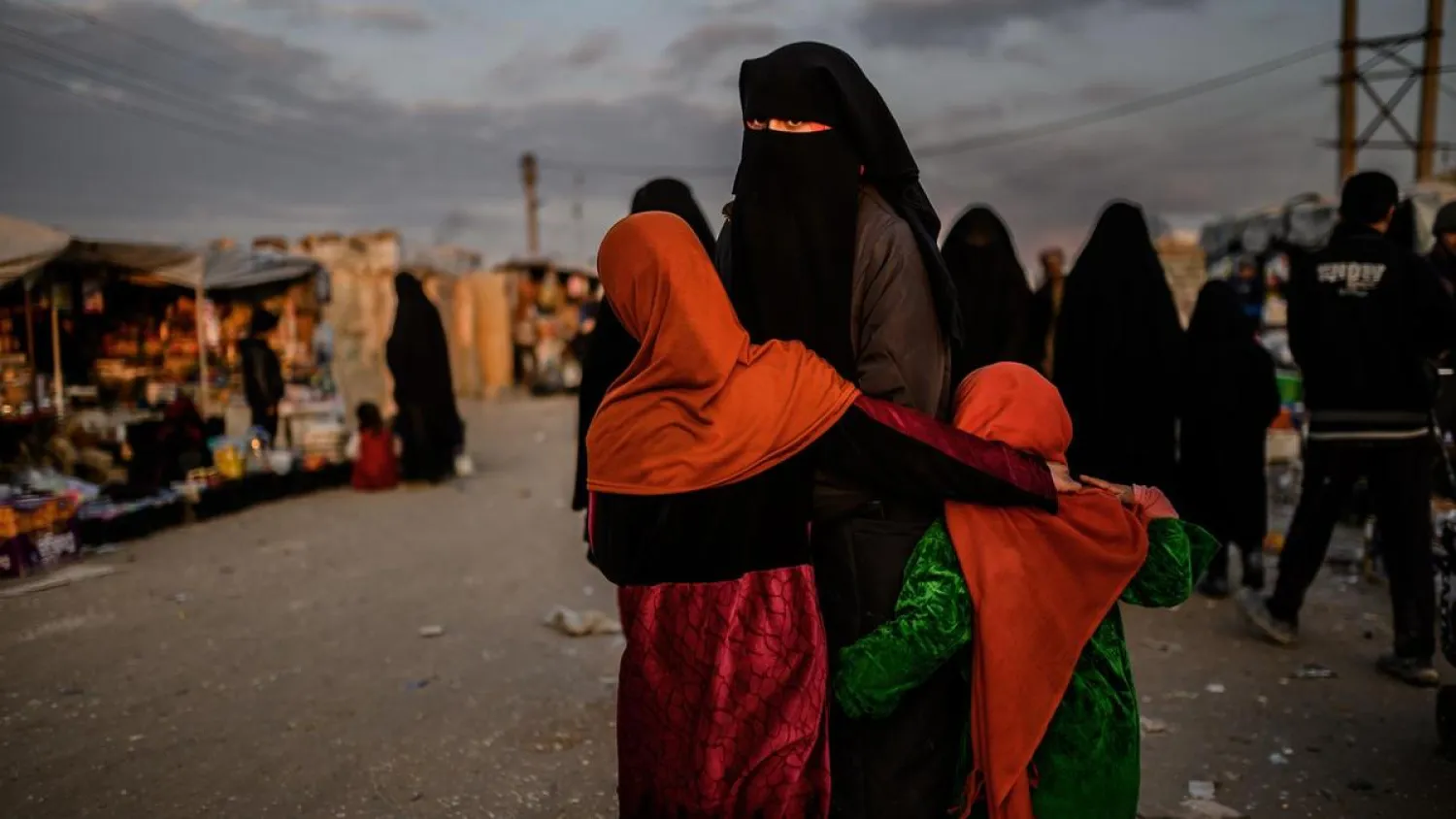 A veiled woman looks back at al-Hol camp in Hasakeh governorate in northeastern Syria. (AFP)