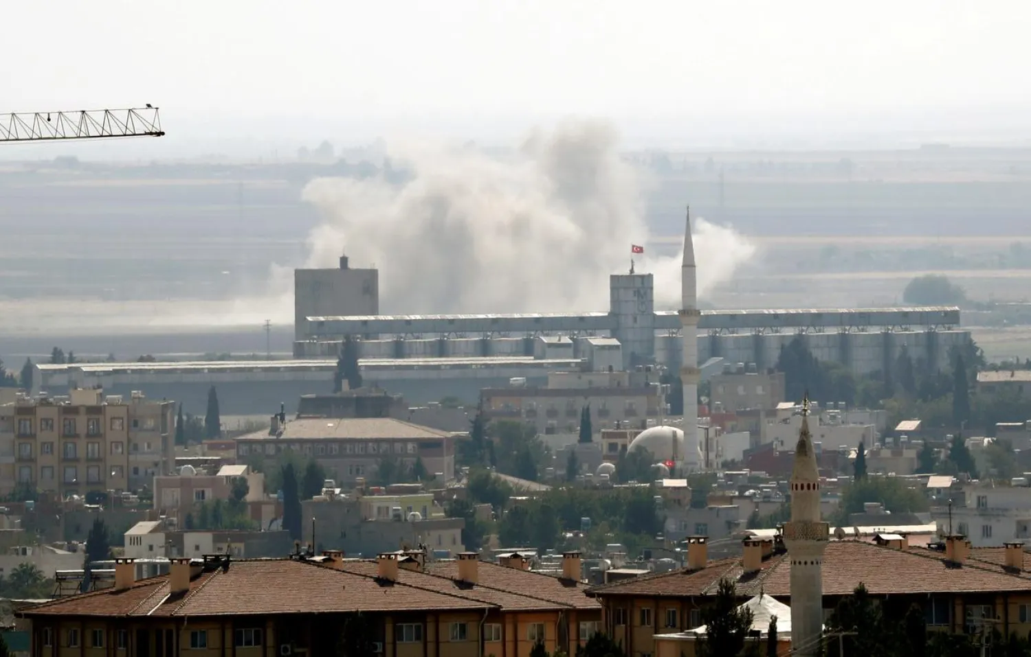 Smoke billows out after Turkish shelling on the Syrian border town of Ras al-Ain, as seen from Ceylanpinar, in Sanliurfa province, Turkey, October 13, 2019. (Reuters)