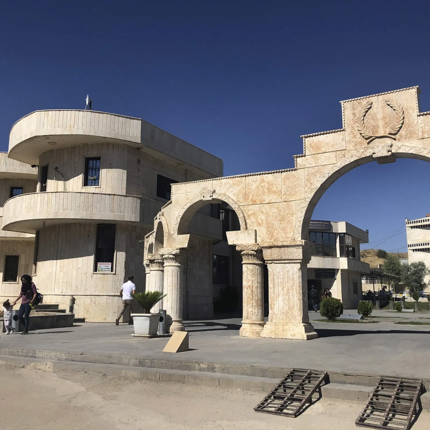 Syrians walk at the border crossing between Iraq and Syria in Semelka, northeast Syria, Monday Oct. 14, 2019. (AP)