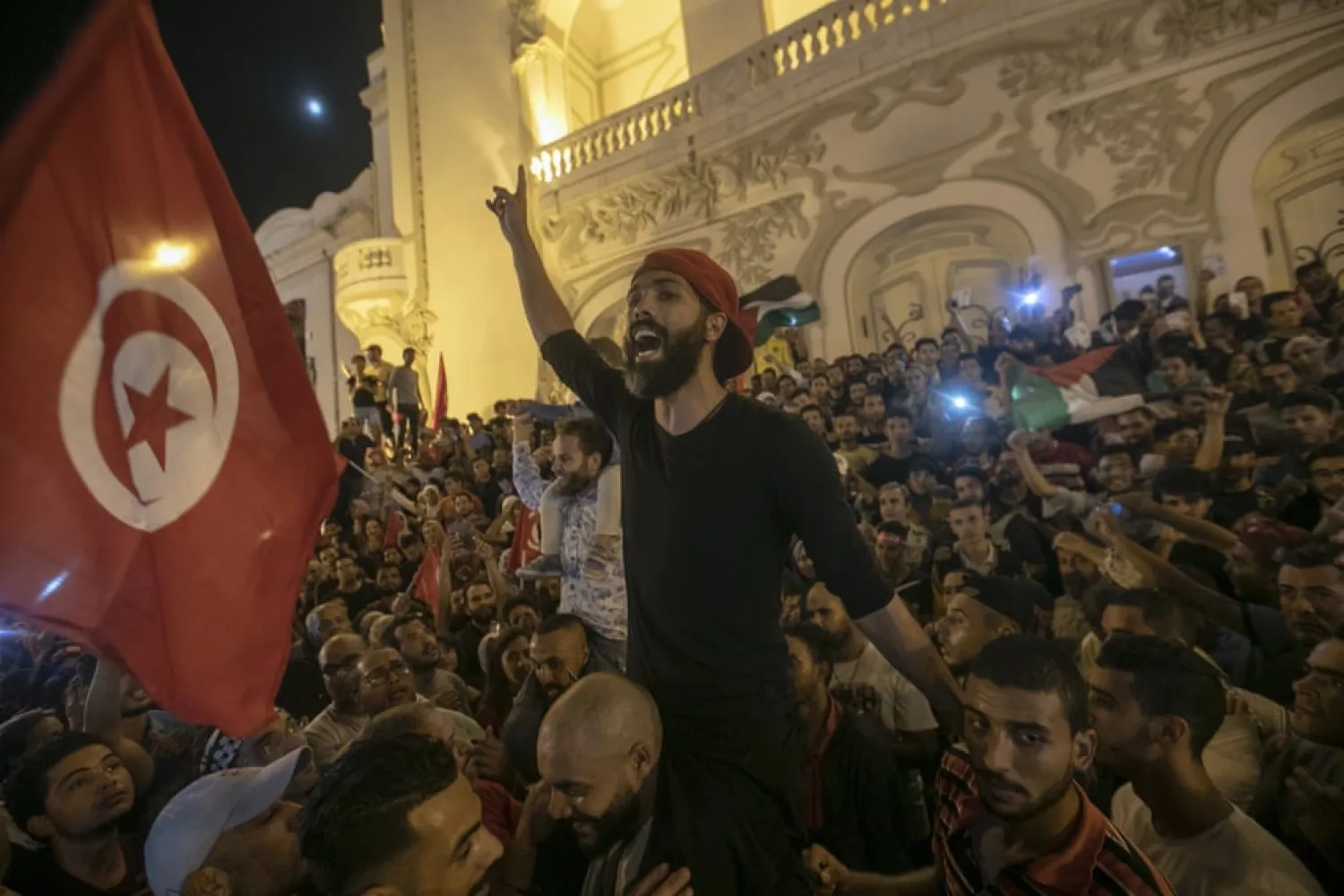 Tunisians gather to celebrate the victory of independent candidate Kais Saied after he has secured more than 72 percent of votes in the presidential election, Tunis, Tunisia. (Getty Images)