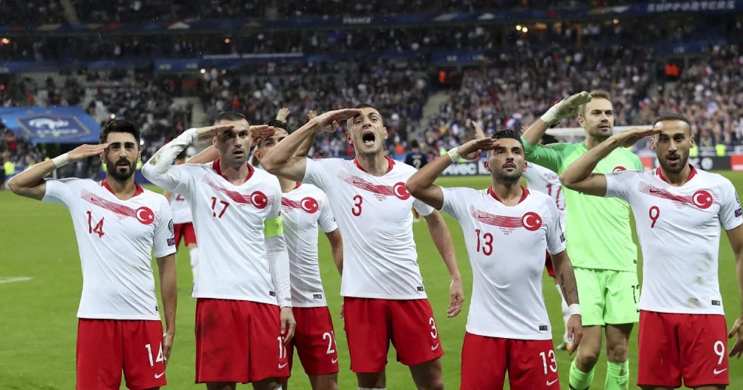 Turkey's players salute as they celebrated a goal against France during the Euro 2020 qualifier at Stade de France at Saint Denis, north of Paris, France, Monday, Oct. 14, 2019. (AP)