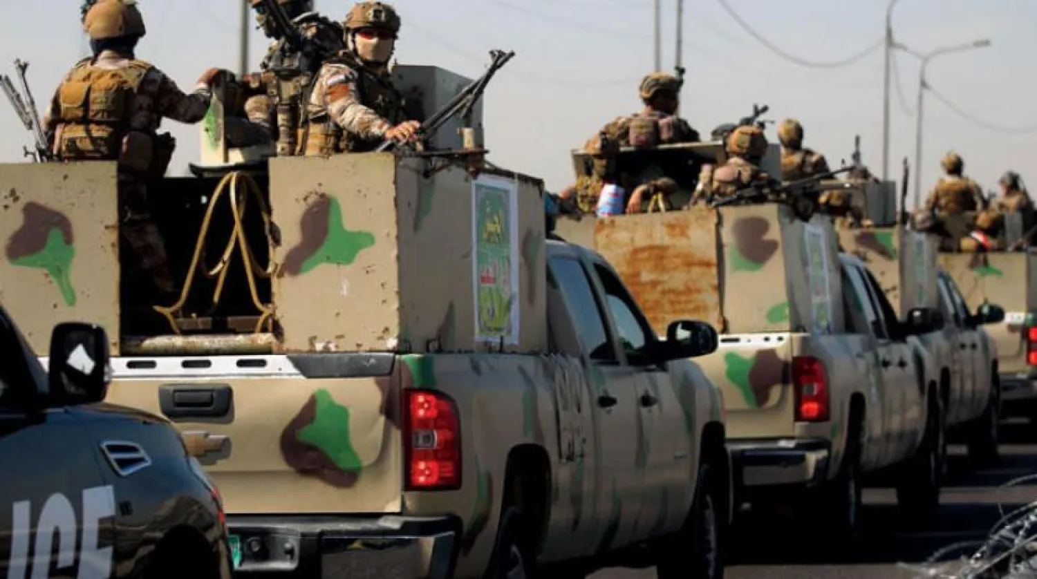 Erbain törenlerinde güvenliği sağlamak üzere dün Kerbela’ya giden askeri konvoy (AFP)