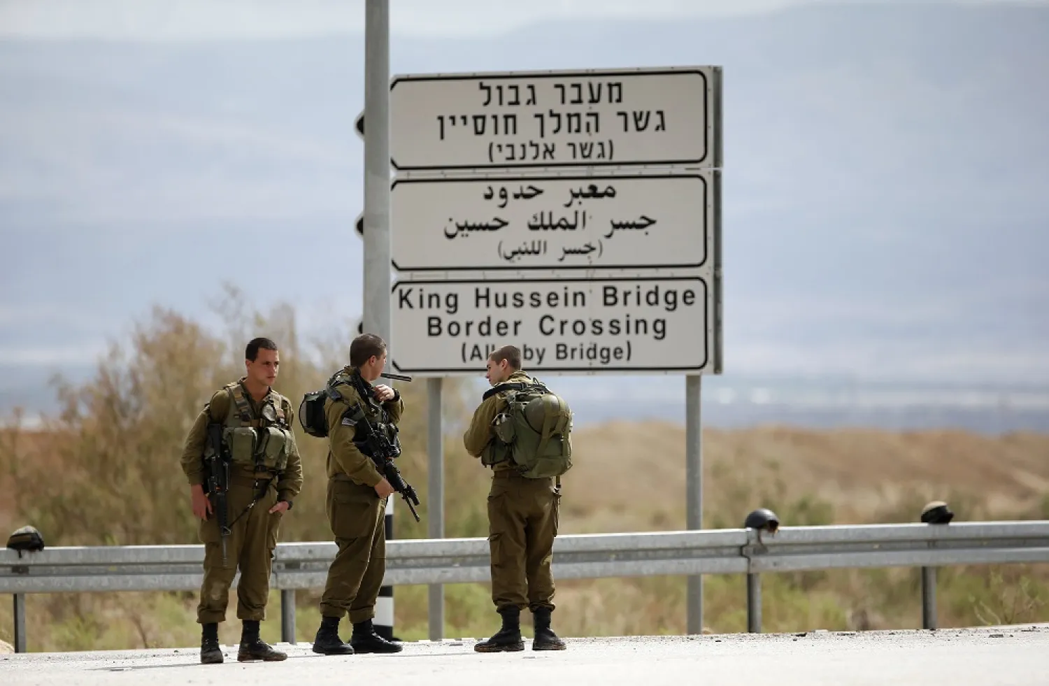 Israeli soldiers stand guard near the entrance to Allenby Bridge. (Reuters)