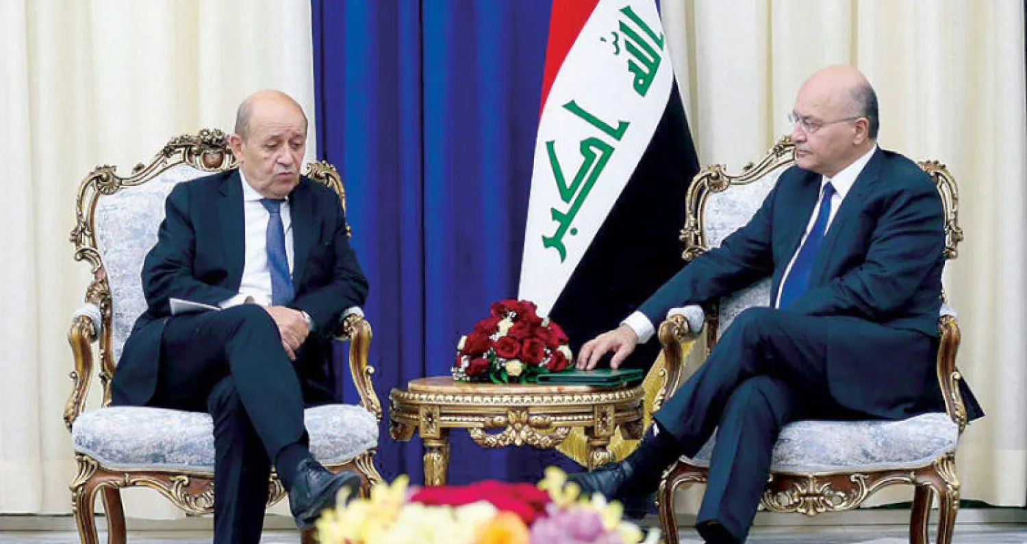 برهم صالح لدى لقائه جان إيف لو دريان في بغداد أمس (الرئاسة العراقية)