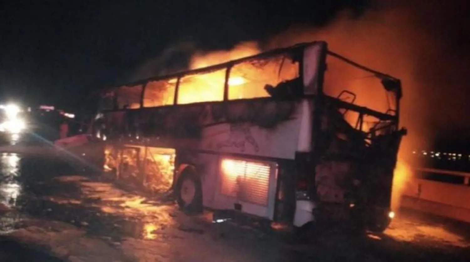 Photo of the bus engulfed in flames