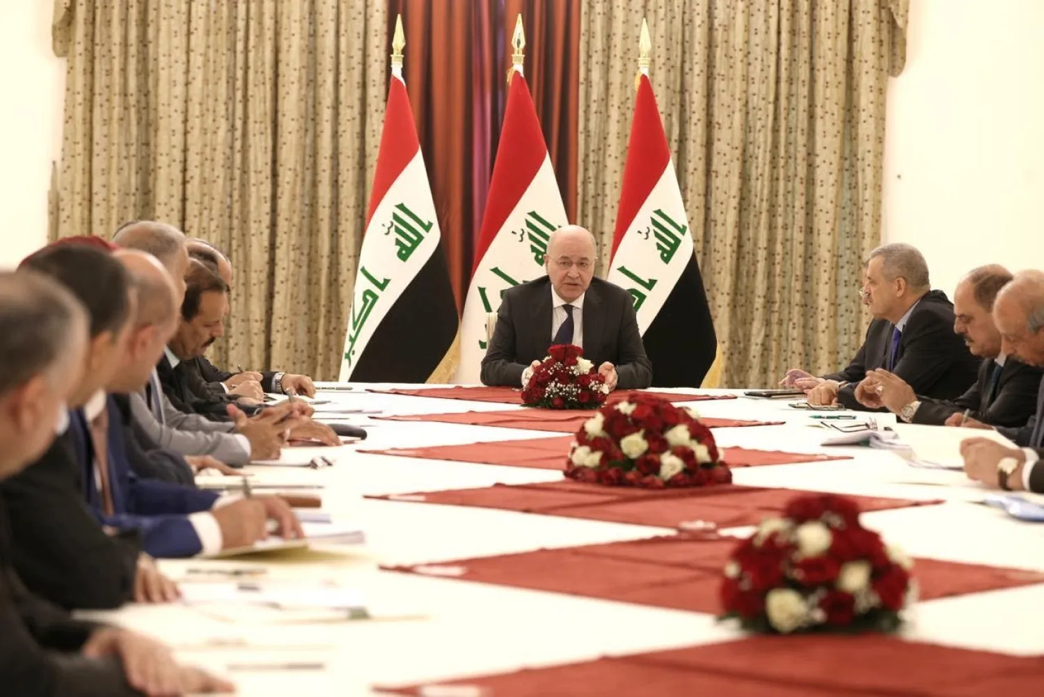 Iraqi President Barham Salih with representatives of the UN and electoral commission and a number of university professors, media professionals, activists, specialists, and legal experts (Iraqi Presidency)