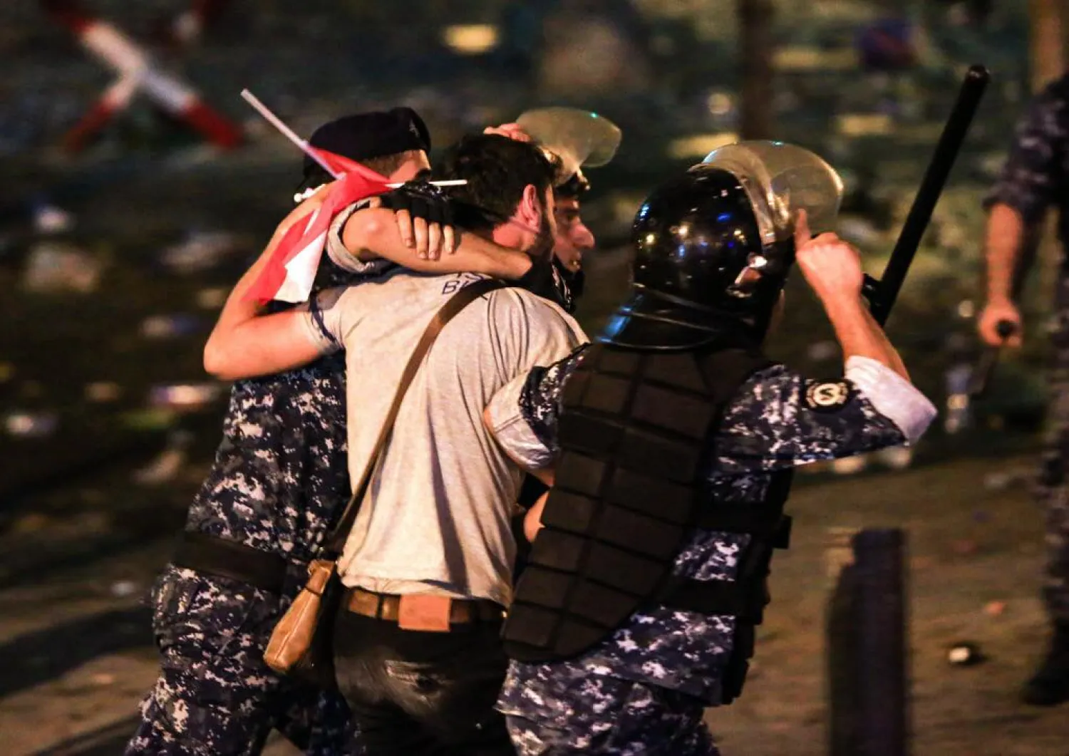 Lebanese security forces say they made 70 arrests dispersing the thousands of protesters who gathered in Beirut's Riyadh al-Solh Square in the largest demonstrations in years | AFP